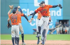  ?? AFP ?? George Springer, No.4, and teammates celebrate the Astros’ win against the Indians.