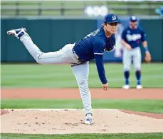  ?? Norm Hall/getty Images ?? Dodgers starter Yoshinobu Yamamoto delivers a first-inning pitch against the Rangers during a spring training game on Wednesday in Surprise, Ariz.