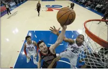  ?? THE ASSOCIATED PRESS ?? The Sixers’ Al Horford, right, might not have a spot in the starting five in the near future. But he’ll still contribute late with plays like this defense against Chicago’s Tomas Satoransky Feb. 9, thanks in part to his veteran poise in the face of a demotion.