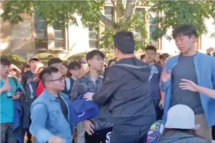  ??  ?? Hong Kong and mainland Chinese students clashed at the University of Queensland in Australia on July 24, 2019.