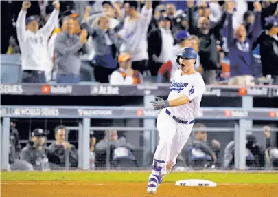  ?? Mark J. Terrill / Associated Press ?? Palo Alto’s Joc Pederson emotes after his third home run of the World Series capped the scoring in Game 6.