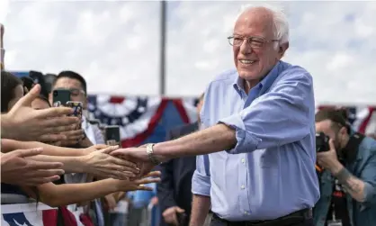  ?? Photograph: Barcroft Media/ Barcroft Media via Getty Images ?? Bernie Sanders greets supporters as he arrives at a campaign rally in Santa Ana, California, on 21 February.