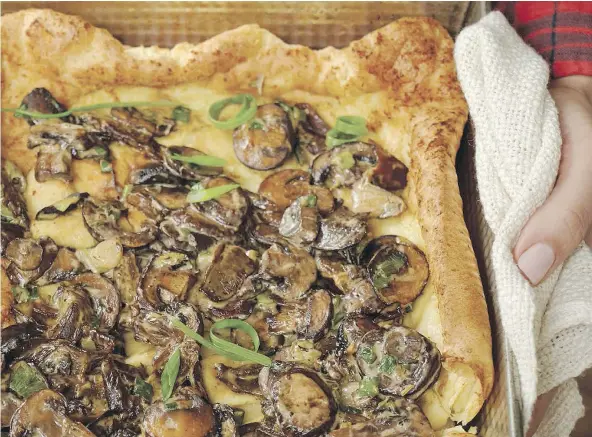  ?? — SUSIE CUSHNER ?? This show-stopping brunch casserole with a popover base and a creamy mushroom filling is easy to assemble.