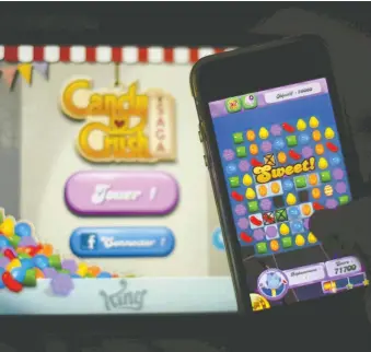  ?? GABRIEL BOUYS/AFP/GETTY IMAGES ?? Candy Crush Saga is among the top mobile games in North America.