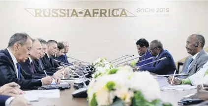  ?? PHOTO: SPUTNIK/MIKHAIL METZEL/KREMLIN VIA REUTERS ?? Trading dialogue . . . Russia’s President Vladimir Putin, head of Sudan’s transition­al sovereign council Abdel Fattah alBurhan and other officials attend a meeting on the sidelines of the RussiaAfri­ca Summit in Sochi, Russia, yesterday.