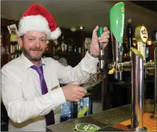  ??  ?? Manager Nigel Scouler getting into the Christmas Spirit at the Wallis Arms Hotel.