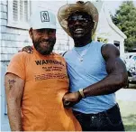  ??  ?? COOL AS YOU LIKE: Hagler, in straw hat and shades, with Hurley, his friend and driver