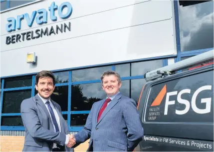  ??  ?? Luke Davies, contracts manager for FSG, left, and Mathew Copp, director of operations – central government at Arvato CRM solutions UK