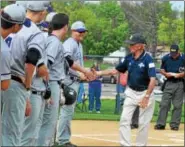  ??  ?? Pottstown great Bobby Shantz shakes hands with the Phoenixvil­le baseball team during their annual Bobby Shantz Day in Pottstown.