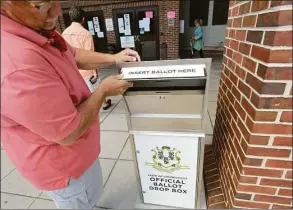  ?? Erik Trautmann / Hearst Connecticu­t Media ?? Metal boxes, bolted to sidewalks throughout the state, were purchased in 2020 using federal COVID-relief funding to make it easier for voters to cast absentee ballots.