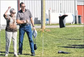  ?? DESIREE ANSTEY/ JOURNAL PIONEER ?? Lauretta Gallant and her son Roger participat­e in the boot toss, a highlight of the festival for them.