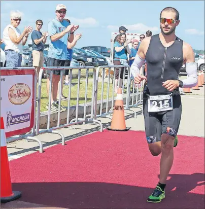  ?? AMANDA JESS/THE NEWS ?? Sydney River’s Corey Deveaux was the winner of the Olympic triathlon distance at the Melmerby Triathlon on Sunday in a time of 2:03:22