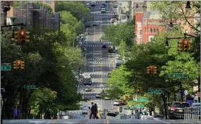  ??  ?? AP PHOTO
Pedestrian­s cross Amsterdam Avenue Wednesday, May 20, 2020, in New York.