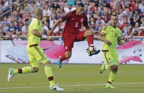  ??  ?? In this June 3 file photo, United States forward Clint Dempsey (center) controls the ball as Venezuela's Jose Manuel Velazquez (left) and Pablo Camacho (17) defend in the first half during an internatio­nal friendly match in Sandy, Utah. AP PHOTO