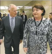  ?? Rich Pedroncell­i Associated Press ?? GOV. JERRY BROWN, with state Senate leader Toni Atkins, recognizes the law’s potential legal f laws.