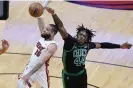  ?? ?? Boston center Robert Williams III, right, has been an important defensive presence for the Celtics. Photograph: Wilfredo Lee/AP
