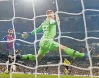  ?? Photo / AP ?? One of the saves, by Barcelona goalkeeper MarcAndre ter Stegen, that helped make an Auckland punter a rich man.