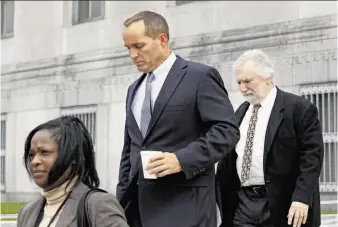  ?? Gerry Broome / Associated Press ?? Andrew Young (center), former aide to ex-u.s. Sen. and presidenti­al candidate John Edwards, leaves court with a federal official and attorney David Geneson (right) in Greensboro, N.C.