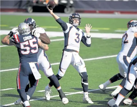  ?? Andy Cross, The Denver Post ?? Broncos quarterbac­k Drew Lock passes against the New England Patriots in the first quarter on Sunday. Lock has a quarterbac­k rating of 66.9 compared with Kansas City’s Patrick Mahomes at 110.1.