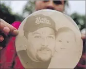  ??  ?? A PHOTO of DeLeon is displayed. The 48-year-old father of two remains in critical condition.