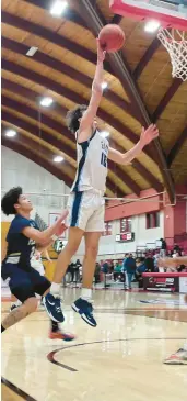  ?? LORI RILEY/HARTFORD COURANT ?? Rob Elliott goes up for a shot for East Catholic in the CCC tournament boys basketball semifinal against Platt on Monday afternoon at the University of Hartford.