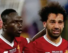  ?? ?? Crying shame: Mane (left) consoles a tearful Salah