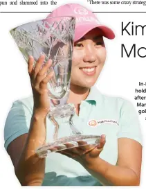  ??  ?? In-Kyung Kim holds the trophy after winning the Marathon Classic golf tournament at Highland Meadows Golf Club in Sylvania, Ohio on Sunday. (AP)