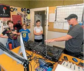  ?? SIMON O’CONNOR/STUFF ?? Asher Ryan, Emma Ritchie and Aiden Williams, all 11, get a tour of the Most FM studio with programme director Jack Irving.