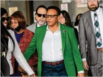  ?? JENNI GIRTMAN FOR THE AJC ?? Pastor Mitzi Bickers (center) leaves the Richard B. Russell federal courthouse on March 23 after a jury found her guilty on nine of the 12 felony counts against her, including money laundering, wire fraud and filing false tax returns.