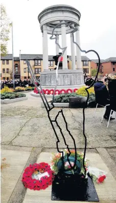  ??  ?? Tribute The silhouette statues are in place across North Lanarkshir­e, including another at Airdrie war memorial