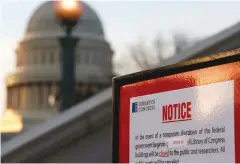  ?? (Joshua Roberts/Reuters) ?? A SIGN announces the closure of the Library of Congress in Washington on Saturday.