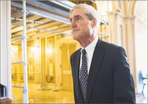  ?? J. Scott Applewhite / Associated Press file photo ?? In this photo, special counsel Robert Mueller departs after a meeting on Capitol Hill in Washington. A redacted version of Mueller’s Russia report was released Thursday.