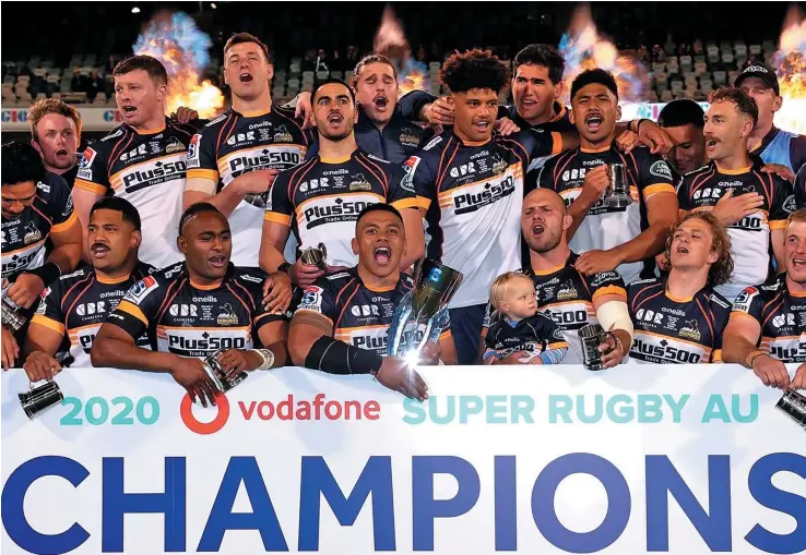  ?? Photo: ?? Brumbies with Fijian players Tevita Kuridrani (front, second from left) and Rob Valetini (back, seventh from left) celebrate winning the first Super Rugby AU title at the GIO Stadium in Canberra, Australia, on September 19, 2020. Brumbies beat Reds 28-23 in the final. 7news