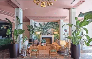  ?? ?? The lobby at the Savoy Hotel in Miami Beach on March 18. Completed in 1937, the Savoy Hotel is a classic example of Miami Beach Art Deco aesthetic, which is reflected in the building’s interior, thanks to the geometric patterns in the columns and molding as well as the bold jewel tones.