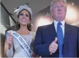  ??  ?? Win: Trump and Miss Universe Gabriela Isler at the 2013 contest in Moscow