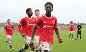  ?? Photograph: John Peters/Manchester United/Getty Images ?? Kobbie Mainoo playing for Manchester United under-18s in 2021. The academy graduate has become a first-team regular at Old Trafford, and recently sent a touching social media video to a bereaved fan.
