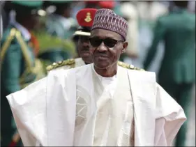  ?? AP PHOTO/SUNDAY ALAMBA ?? In this Friday, May 29, 2015, file photo, Nigerian President elect, Muhammadu Buhari, arrives for his Inaugurati­on at the eagle square in Abuja, Nigeria.