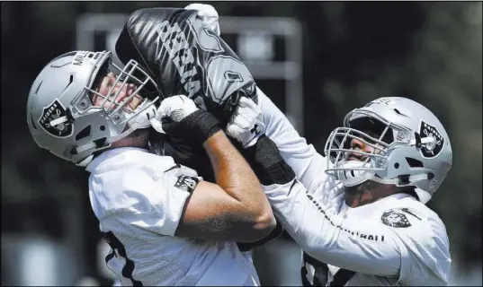  ?? Ben Margot The Associated Press ?? Kolton Miller, left, the Raiders’ first-round pick out of UCLA, should be a candidate to start at offensive tackle.