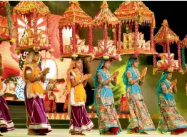  ?? — AP ?? Artists perform during a Navratri function in Ahmedabad on Thursday.