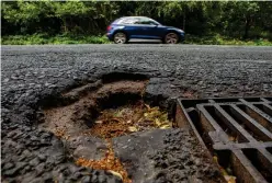  ?? ?? Potholes on Dumbreck Road in the Southside