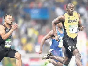  ??  ?? Jamaica’s Usain Bolt and Canada’s Andre De Grasse.