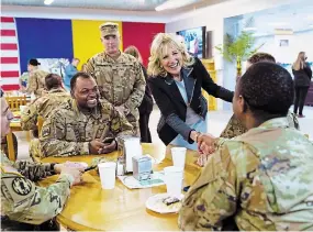  ?? SUSAN WALSH THE ASSOCIATED PRESS ?? First lady Jill Biden meets U.S. troops during a visit to the Mihail Kogalnicea­nu Air Base in Romania on Friday.