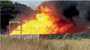  ??  ?? The trailer well ablaze after driver Deane Rodgers got it to the Makikihi Hotel truck stop car park.