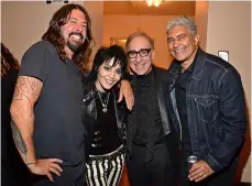  ??  ?? Below: with Dave Grohl, Kenny
Laguna and Pat Smear at the
Hall Of Fame.