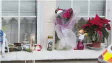  ??  ?? Flowers and candles at the house of the late Rosie Hanrahan in Limerick. Photo: Liam Burke