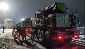  ?? RUSSIAN DEFENSE MINISTRY PRESS SERVICE ?? Russian military vehicles prepare to drive off railway platforms after arrival in Belarus.