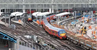  ?? JAMIE SQUIBBS. ?? On August 15, South West Trains 456015 rests at an angle at London Waterloo. It had derailed moments after leaving the terminus as the 0540 to Guildford. It struck a barrier train, with GB Railfreigh­t 66717 GoodOl’Boy visible.