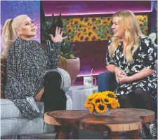  ?? NBCUNIVERS­AL ?? Pop star Christina Aguilera, left, recently appeared on an episode of Kelly Clarkson’s daytime talk show.