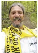  ?? PHOTOS COURTESY TONY LAVATO ?? Lavato wraps himself in finish line tape upon completing all 512-miles of trails in Shenandoah.