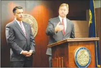  ?? YVONNE GONZALEZ ?? U.S. Sen. Dean Heller, R-nev., right, f lanked by Nevada Gov. Brian Sandoval, speaks during a joint news conference June 23 to discuss Heller’s opposition to cuts to Medicaid proposed under a GOP health care plan that would replace Obamacare.